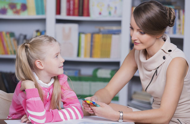 Therapist talks with a child